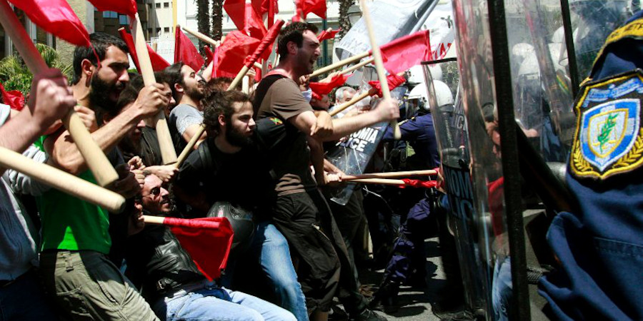Protesters clash with policemen during riots at a May Day rally in Athens