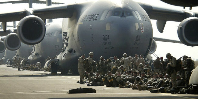 U.S._Army_paratroopers_of_the_173rd_Airborne_Brigade_prepare_to_board_C-17_Globemaster_IIIs_in_support_of_Operation_Iraqi_Freedom_on_March_23_2003_at_Aviano_Air_Base_Italy